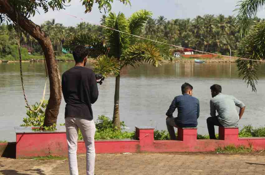 Sound recordist capturing audio on a film set