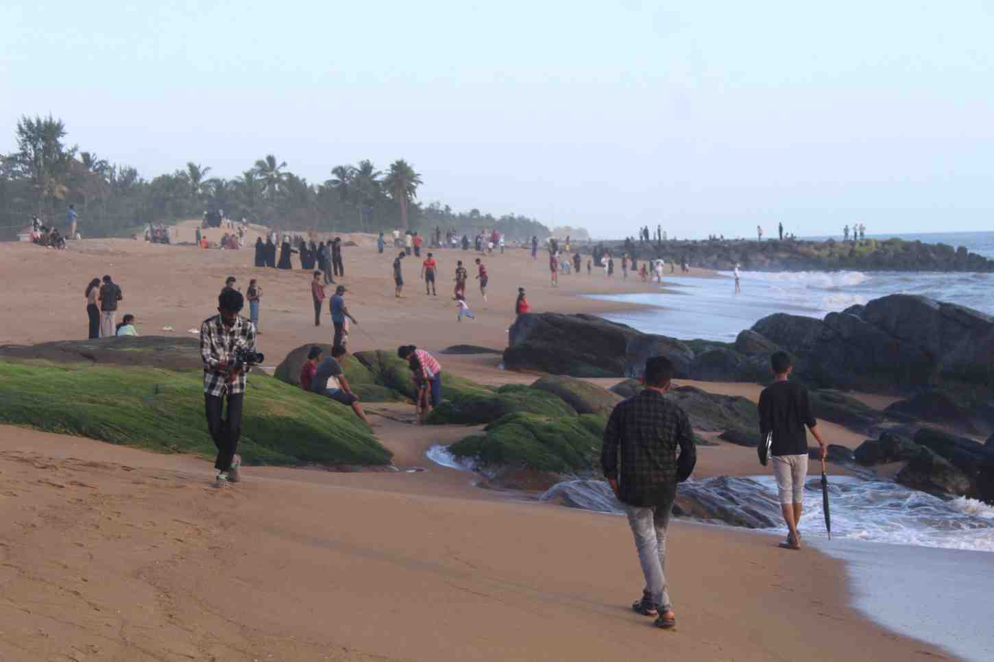 Film crew capturing a wide shot of a landscape